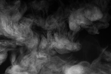 Blur white water vapour on isolated black background. Abstract of steam with copy space. Steam flow. Smoke on white background.