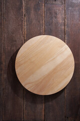 circle wood cutting board on wood  background