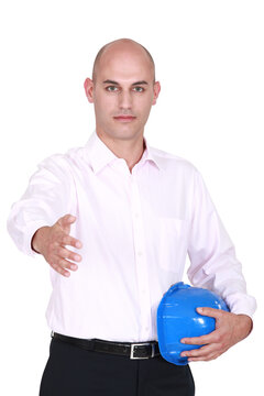 Bald architect offering to shake-hand
