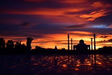 Sunset view with red clouds, golden yellow, colorful sky at the Central Mosque, Songkhla Province.