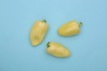 Bell peppers on blue background. Top view