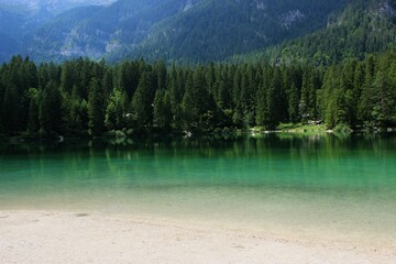 LAKE TOVEL, ITALY, 2017, landscape view of a mountain lake and wood, trees, forest
