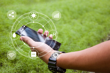 Innovation technology for the smart farm system, Agriculture management, Hand holding smartphone...