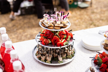 A set of canapes and snack at a banquet with white table