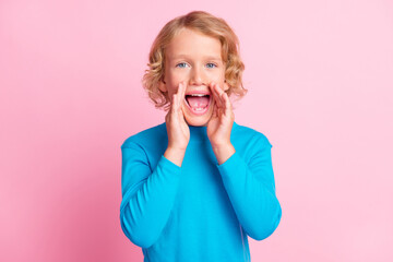Photo of little adorable kid plams open mouth yell wear blue turtleneck isolated pastel pink color background