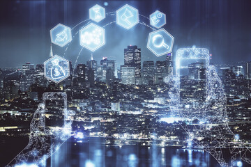 Double exposure of technology theme hologram and cityscape background. Concept of Hightech.