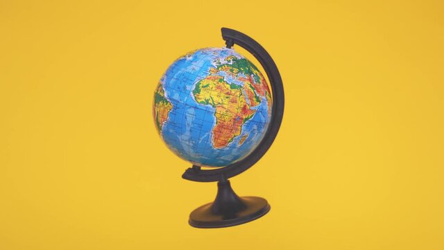 Flying zero gravity globe on yellow background. School class of geography. Ecology concept. Earth day