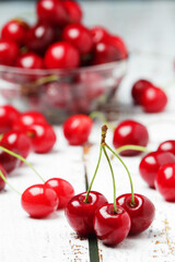 A small glass bowl with ripe fresh cherry