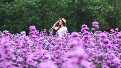 Portrait image of a beautiful young asian woman in Margaret flower field