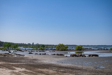 Coastline of a sand beach during low tide at Ngwesaung, Irrawaddy, Myanmar