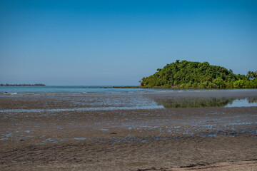 Coastline of a sand beach during low tide at Ngwesaung, Irrawaddy, Myanmar