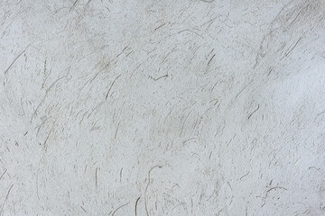 Texture of the wall plastered with cement grey plaster