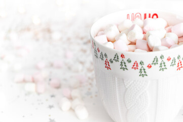 Fototapeta na wymiar Cup with hot chocolate cacao and marshmallows close up on a white background close up