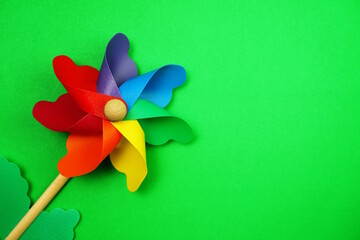colorful pinwheel with space copy isolated on green background