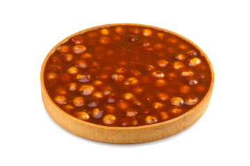 Big tart with caramel and hazelnut isolated on a white