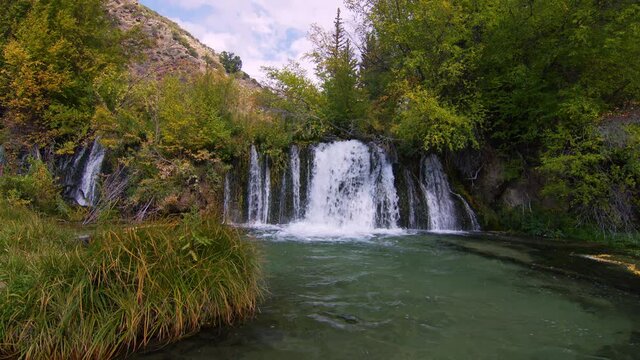Waterfall oasis at Pine Creek in the wilderness of Wyoming in late Summer.