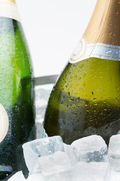 Two bottles of champagne chilling on ice