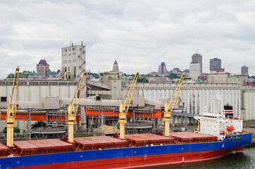 Quebec City downtown skyline with industrial port, industry and business buildings and cargo or...
