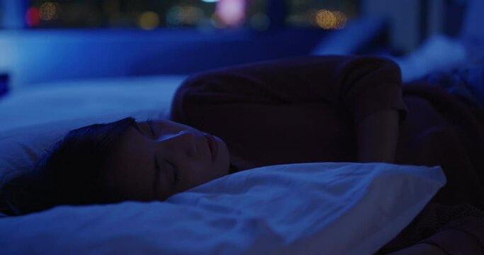 Woman sleep on bed at night