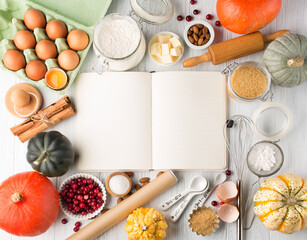 Fototapeta na wymiar Ingredients for autumn winter baking - flour, sugar, eggs, apples, pumpkins and spices.