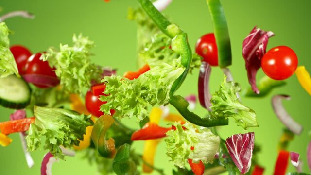 Super Slow Motion Shot of Flying Fresh Vegetables. Super Slow Motion at 1000 fps..