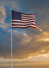 American flag waving during sunset