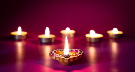 Happy Diwali - Clay Diya lamps lit during Dipavali, Hindu festival of lights celebration