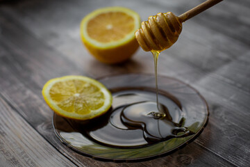 wooden spoon of honey with lemon