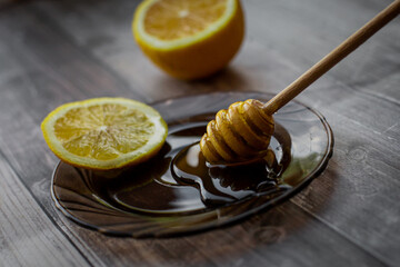 wooden spoon of honey with lemon