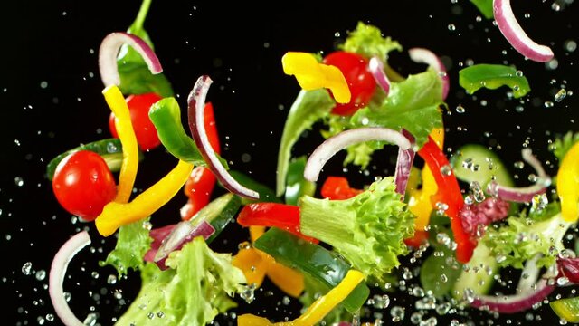 Super Slow Motion Shot of Flying Fresh Vegetables. Super Slow Motion at 1000 fps..