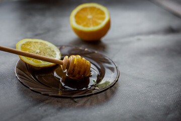 wooden spoon of honey with lemon