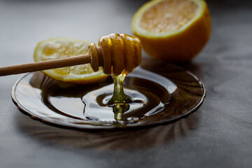 wooden spoon of honey with lemon