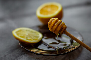 wooden spoon of honey with lemon