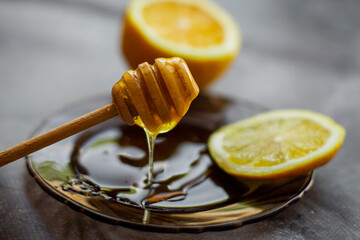 wooden spoon of honey with lemon