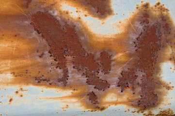 Texture of old blue rusty painted metal wall with smudges and stains close up