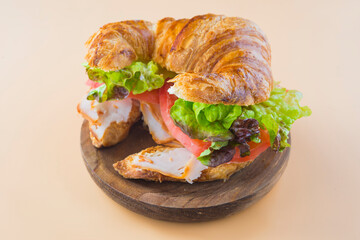 Sandwich of croissant of lettuce, tomato and smoked turkey