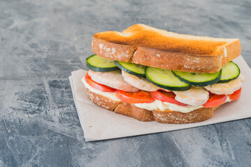 Sandwich chicken with tomato and cucumber
