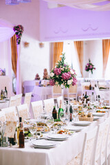 Banquet tables are served for guests in the elegantly decorated halls of the restaurant.