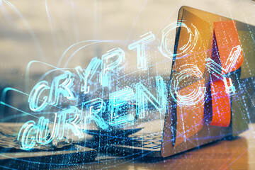Double exposure of blockchain theme hologram and table with computer background. Concept of bitcoin crypto currency.