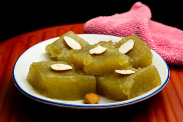 Wheat halwa garnished with badam