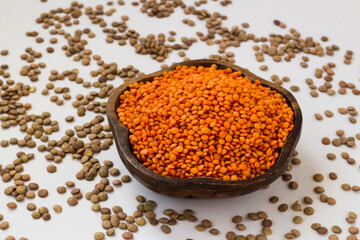 Dry,Red Lentil Wooden Bowl,on white with green lentils.