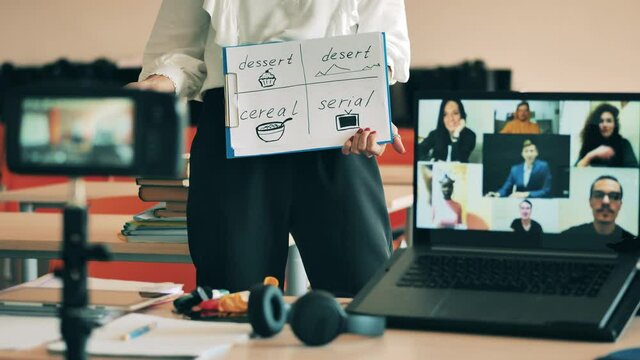 English teacher is carrying out an online lesson for adults. Remote education, online education, remote studying, online learning concept.