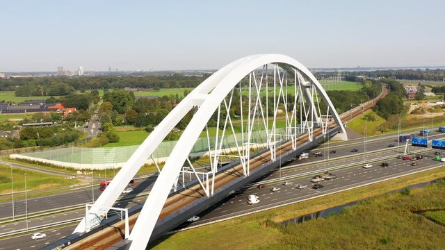 Muiderberg, Noord-Holland / The Netherlands - October 8th 2020: Train bridge Zandhazenbrug over the A1 from Amersfoort to Amsterdam