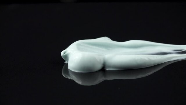 Close-up video of smearing toothpaste