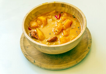Chickpea and pumpkin stew surrounded by white background