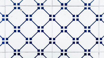 Naklejka premium Portuguese traditional tiles Azulejos with blue geometrical pattern on a white background.