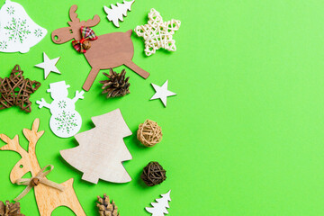Christmas green background with holiday toys and decorations. Happy New Year concept with empty space for your design