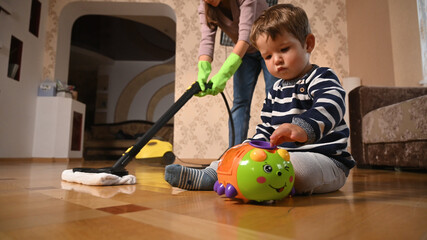 Fototapeta premium Mother cleaning concept in the house