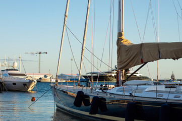 commercial boat tied to the dock in marina