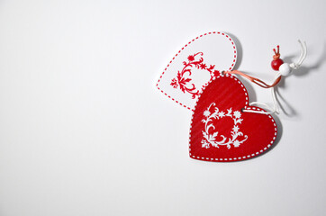 Wooden Hearts and Christmas ornament on white background.